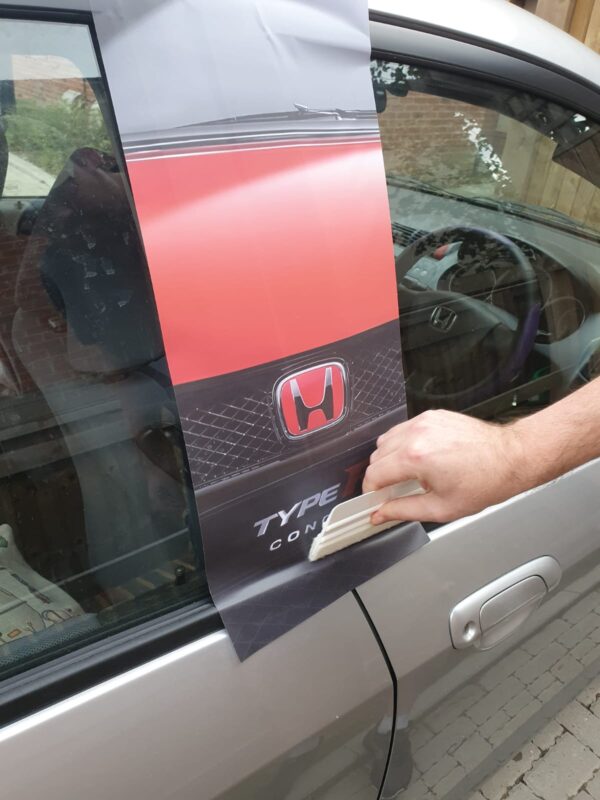 Fitting a B pillar custom any image sticker with a squeegee